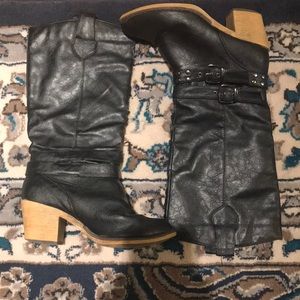 Black heeled mid-calf boots.